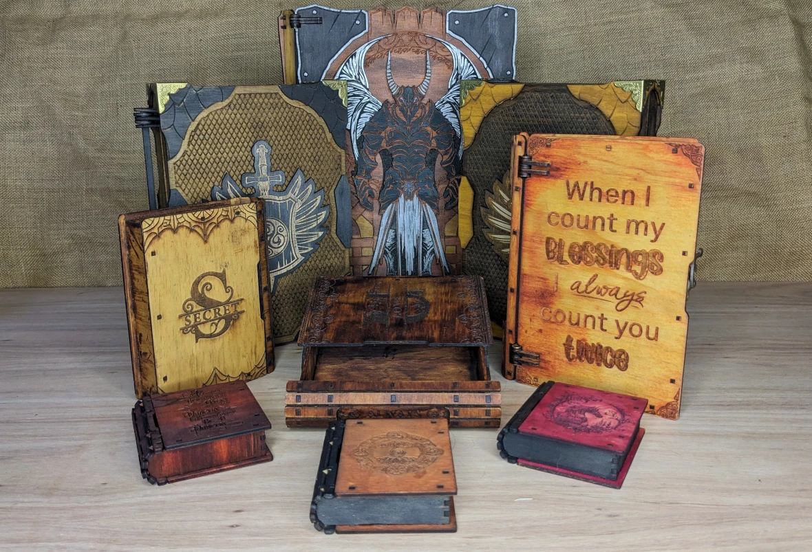 Handcrafted wooden book boxes with fantasy engravings, perfect for gifts and hidden treasures.