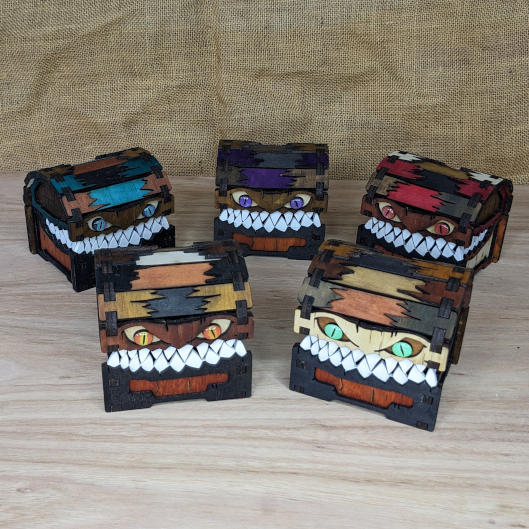 Set of five wooden mimic chests in different colours, fantasy tabletop RPG dice boxes with selectable eye designs and coloured eyes